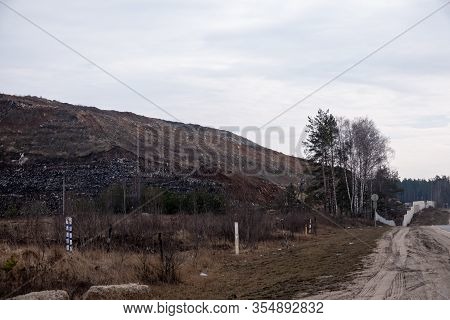 View Of The Mountain Dump With A Tractor