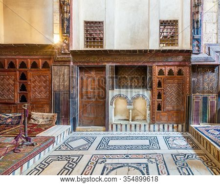 Cairo, Egypt- February 22 2020: Wooden Painted Floral Patterns, Embedded Arched Niche, Wooden Door, 