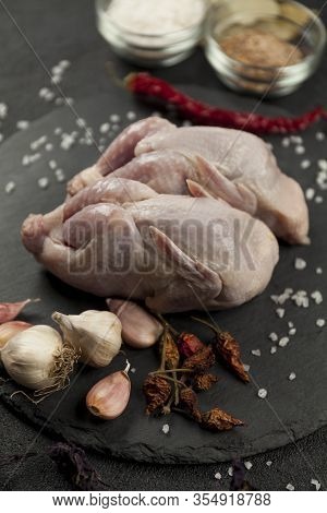 Raw Quail Meat On Kitchen, Cooking Gourmet Bird. Healthy Diet Recipe.