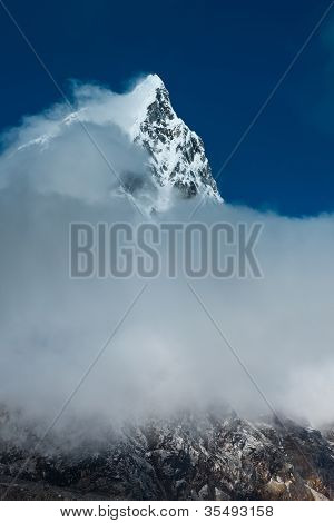 Cholatse Mountain Peak And Clouds