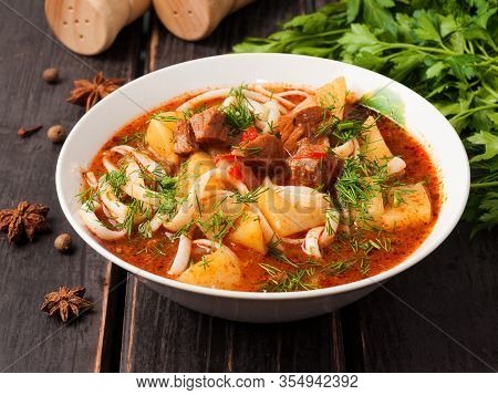 Lagman With Beef In A White Plate On A Wooden Background