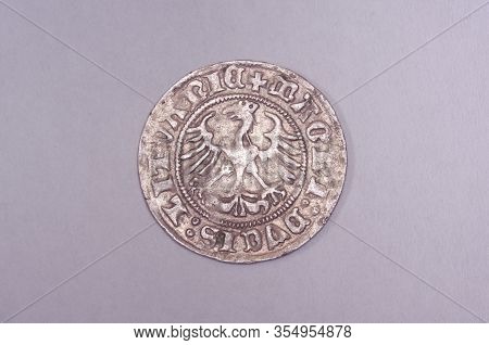 Ancient Grand Duchy Of Lithuania Coin Half-grosz Isolated On The Gray Background