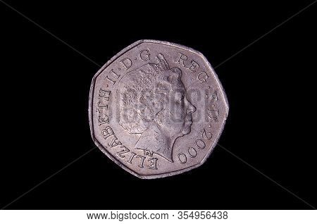 L.50 italian coin isolated on the dark background