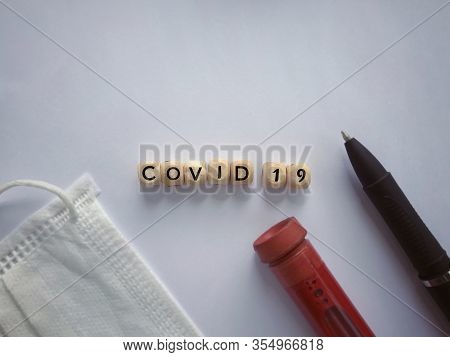 Health Care And Medical Concept. Covid 19 Written On Wooden Blocks.