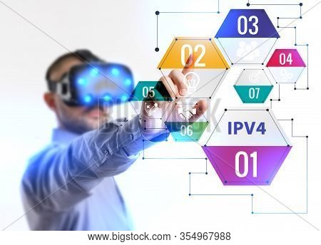 Business, Technology, Internet And Network Concept. Young Businessman Working In Virtual Reality Gla