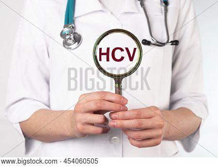 Hcv Test Analysis. Magnifying Glass In Doctors Hand. High Quality Photo