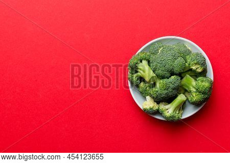 Broccoli Of Fresh Green Broccoli In Bowl Over Coloredbackground. , Close Up. Fresh Vegetable.