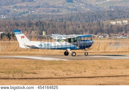 Wangen-lachen, Switzerland, February 13, 2022 Cessna F152 Propeller Plane Is Taxiing On A Small Airf
