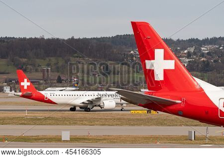 Zurich, Switzerland, February 24, 2022 Helvetic Airways Embraer E190-e2 Aircraft Is Taxiing To The G
