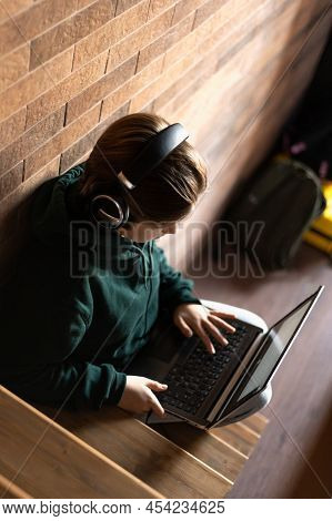 Secondary School Age Teenager Girl Is Home Schooling Using Laptop And Smartphone, Online Education, 