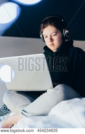 Secondary School Age Teenager Girl Is Home Schooling Using Laptop And Smartphone, Online Education, 