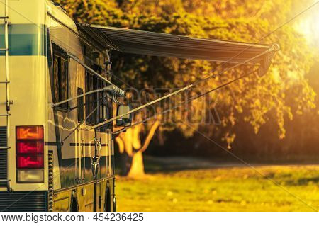 Class A Recreation Vehicle Diesel Pusher Motorhome Camping Spot. Motor Coach In A Rv Park During Sun