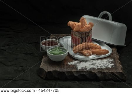 Traditional Spanish Churros Sticks (fried-dough Pastry) Served Usually With Thai Pandan Custard And 