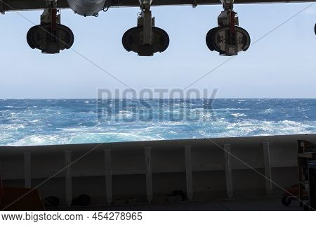 Onboard View From Streamer Deck Towards The Aft Of Seismic Survey Vessel. Empty Cable Blocks Hanging