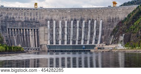 800 Fts Arched Gravity Reinforced Concrete Dam Of Hydroelectric Power Plant. High Resolution Photo, 