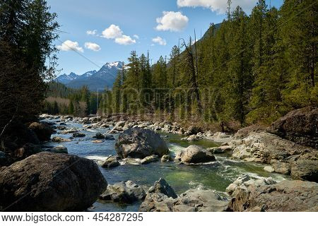 Kennedy River Landscape Vancouver Island. Kennedy River With A View Of The Snow-capped Mountains Of 