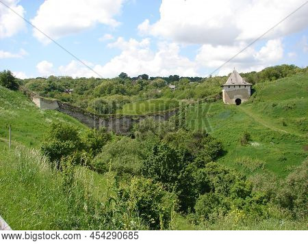 Ancient Fortress, Fort Among Green Grass, Thickets. Beautiful Nature Background. Tourist Place