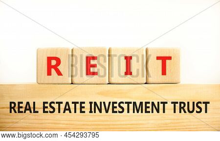 Reit Real Estate Investment Trust Symbol. Concept Words Reit Real Estate Investment Trust On Wooden 