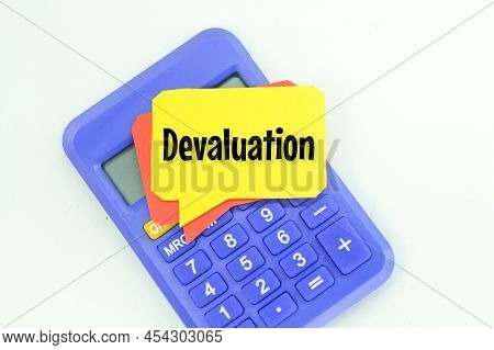 Calculator And A Conversation Box With The Word Devaluation