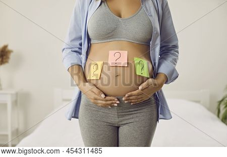 Young Pregnant Lady Thinking Of Name Or Trying To Guess Gender Of Her Future Baby
