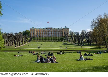 Frederiksberg, Denmark - May 7, 2022: People Enjoying The Sunshine In Front Of The Castle In Frederi