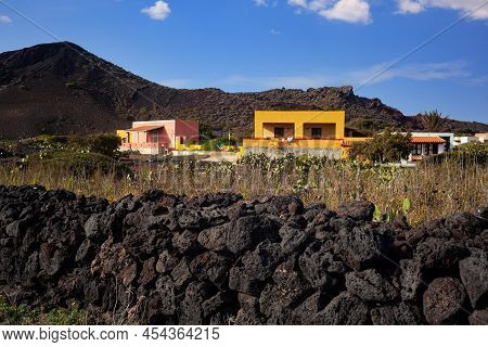 Characteristic View Of Linosa With The Typical Colorful Houses And The Pricly Pears In The Garden