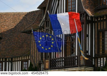 Deauville, France - April 21, 2022 : The Blue European Flag With Yellow Stars And Flag Of France Han