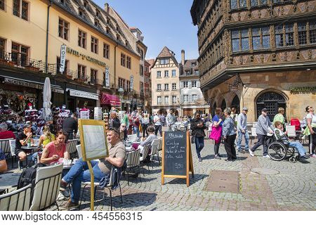 2 Of May 2022, Strasbourg, France. A Lot Of People Sitting In Restaurants In The Main Square Near Th