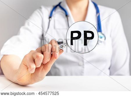Pp Vitamin, Word Acronym Through Magnifying Glass. High Quality Photo