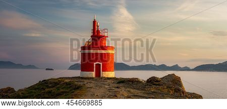 Landscape View At The Iconic Red Lighthouse In Punta Robaleira, In Cabo Home, Cangas, Spain