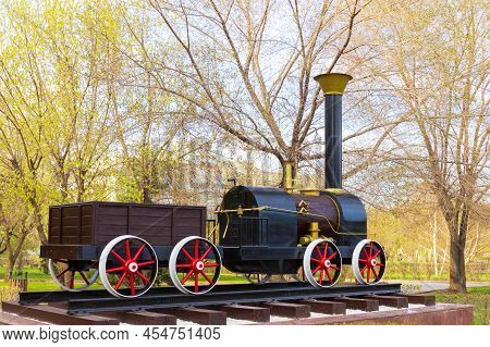 Krasnoyarsk, Russia - May 5, 2022: Monument To The Cherepanov Steam Locomotive. Cherepanov Steam Loc
