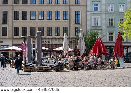 Copenhagen, Denmark - May 07, 2022: People On Vesterbros Torv In Vesterbro District Enjoying A Sunny