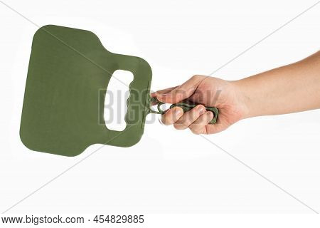 Green Fan In Hand On A White Background To Fan The Fire, Close-up. Isolate