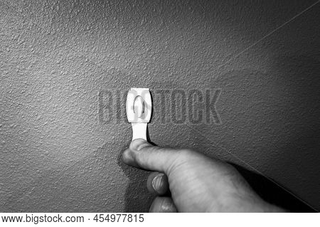 Selective Focus On Adhesive Strip Wall Hanger That Can Be Removed By Pulling Tape