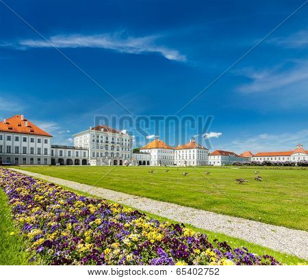 MUNICH, GERMANY - MAY 8, 2012: Swans in artificial pool in front of the Nymphenburg Palace. Munich, Bavaria, Germany