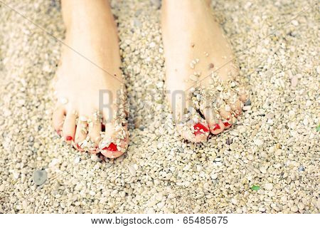 Summer, feet on the beach