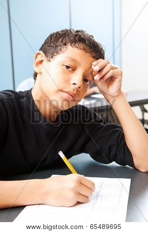 Teen boy worried about taking a standardized test.  