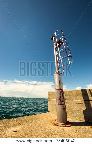Little Beacon On A Dock Of An Italian City
