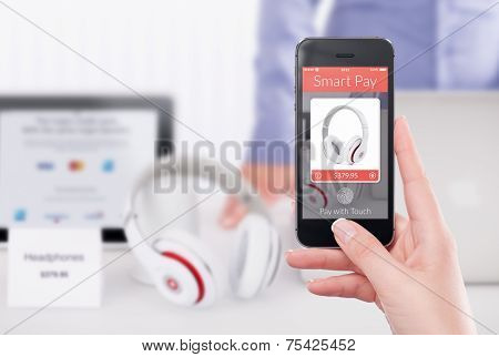 Directly Front View Of A Smartphone With Smart Pay Application On The Screen In Female Hand