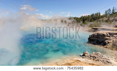 The blue lake in fog, Yellowstone, Excelsior Geyser Crater.