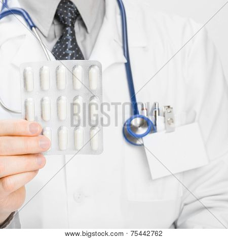 Doctor Holdling Pills In His Hand - Heath Care Concept
