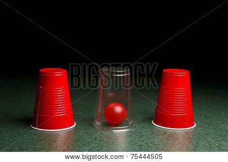 Red Ball Hidden Under Clear Cup