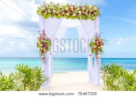 wedding arch and set up on beach, tropical outdoor wedding cabana on beach
