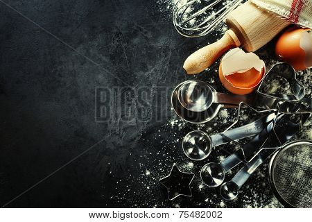 baking background with eggshell and rolling pin