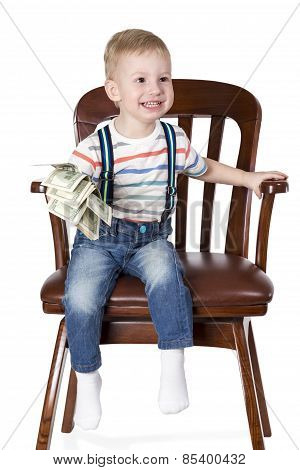 Boy Sitting In Chair And Holding Money