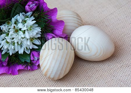 Snowdrop flowers and wooden eggs