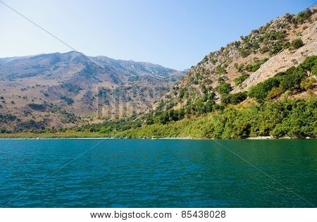 Landscape. Picturesque mountain lake on a sunny summer day.