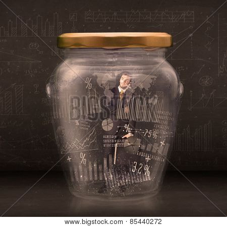 Businessman traped in jar with graph chart symbols concept on background