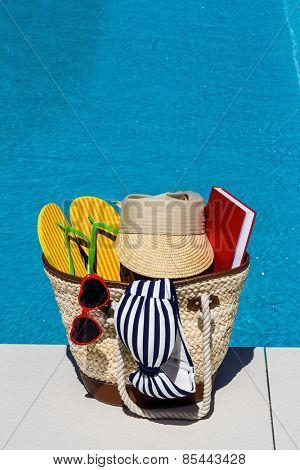 utensils for a nice relaxing vacation day lying next to a swimming pool. relaxation on vacation.