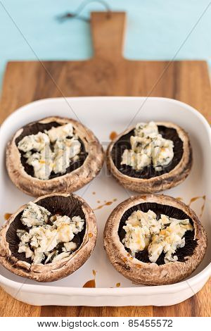 Portobello Mushrooms Stuffed With Blue Cheese And Drizzle Of Haney, Ready To Be Baked